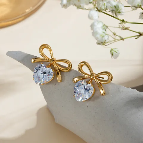 Solitaire heart and bow earrings
