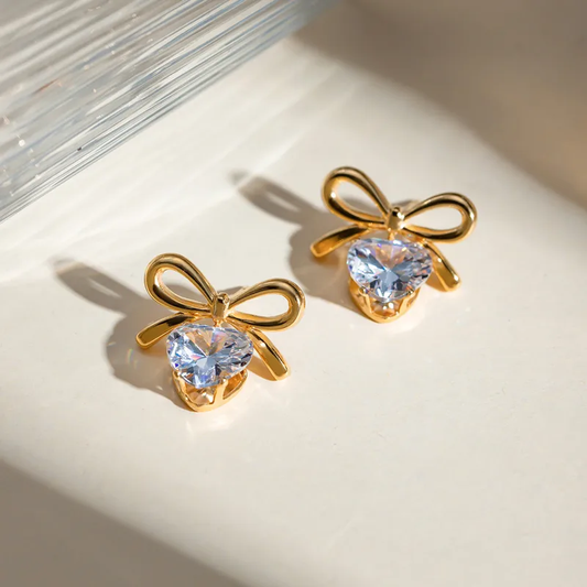 Solitaire heart and bow earrings